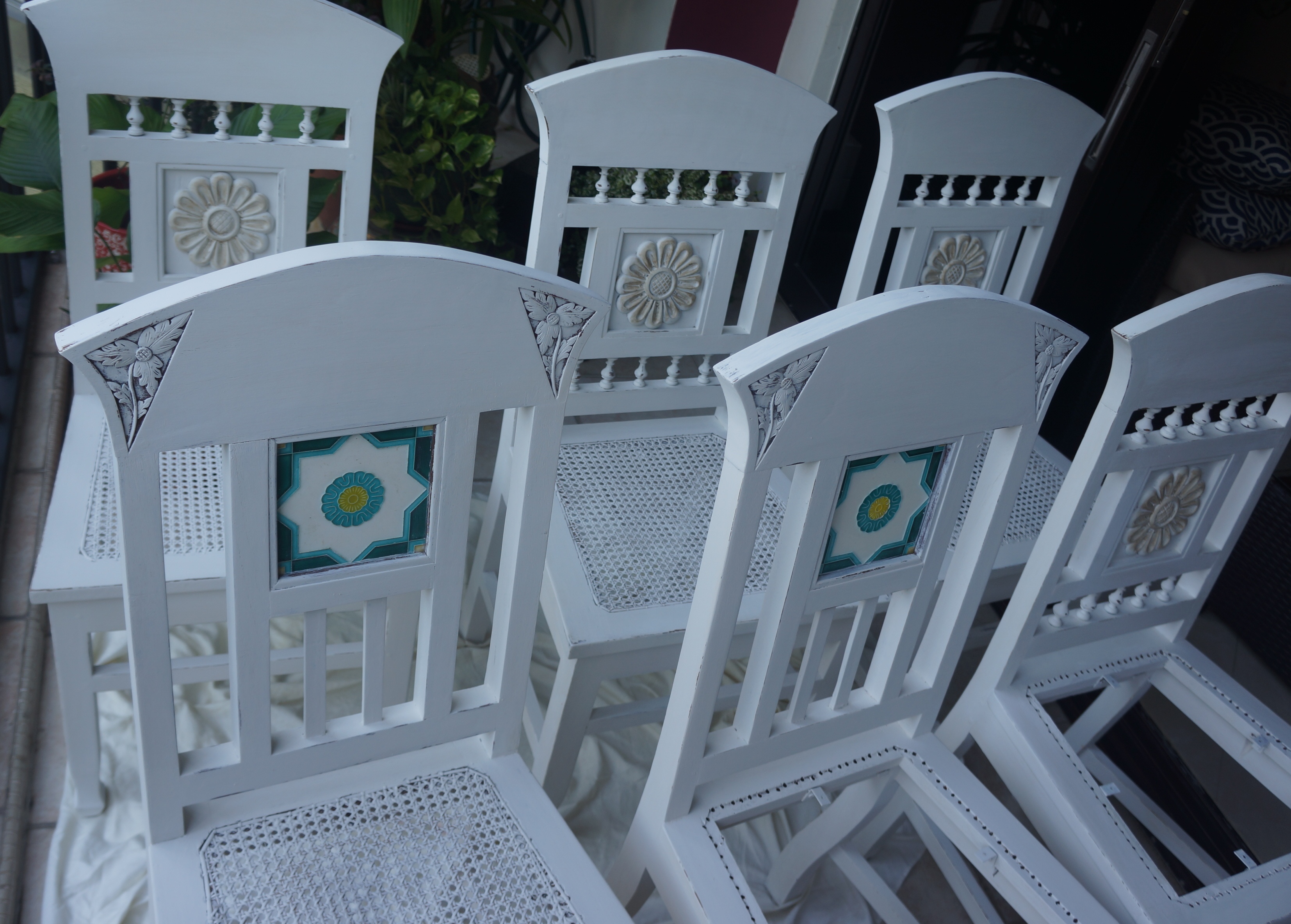 Wooden dining chairs in white.