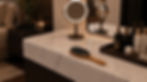 Bass Brushes Elegant marble vanity with lit round mirror, hairbrush, and skincare bottles in a cozy bedroom.