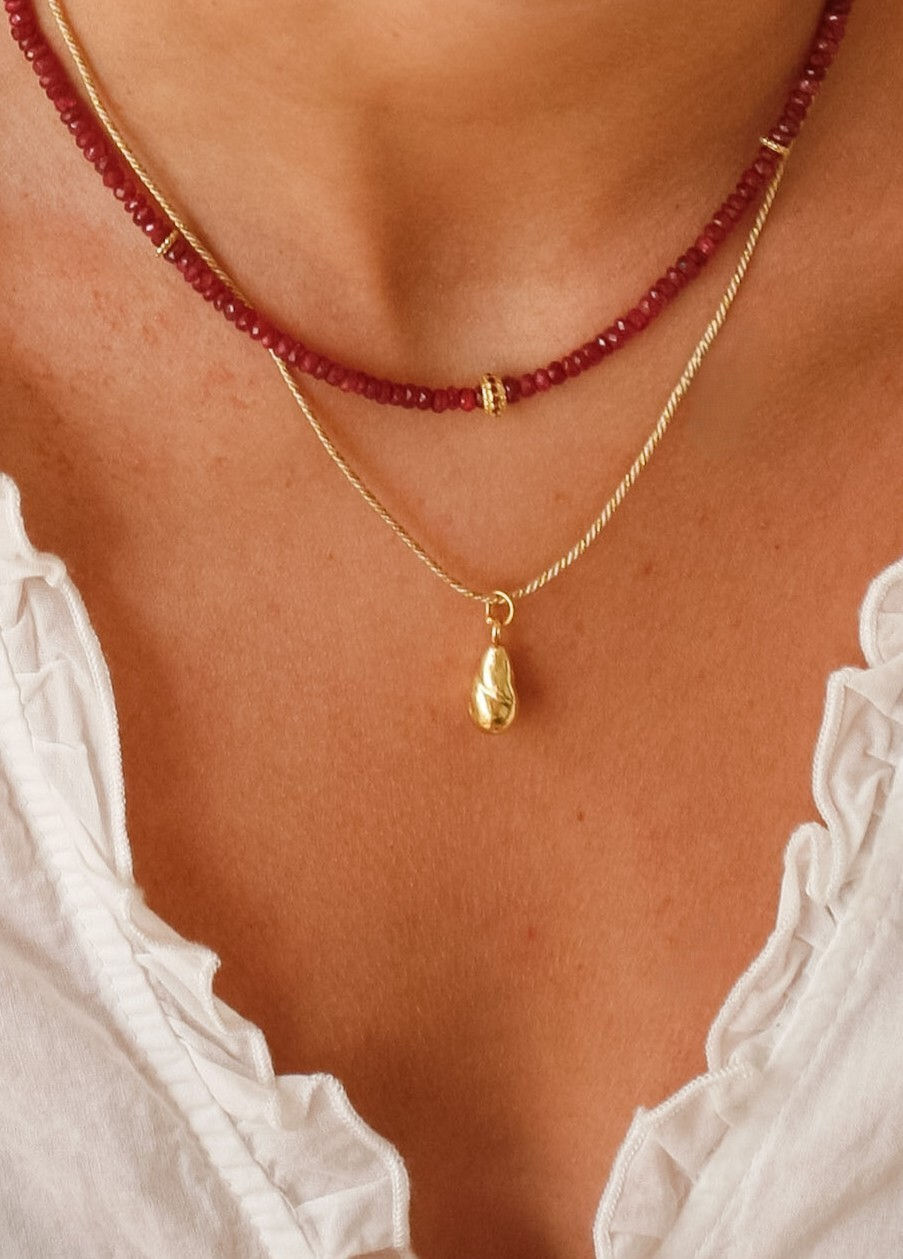 Thumbnail: Twisted gold drop on cord