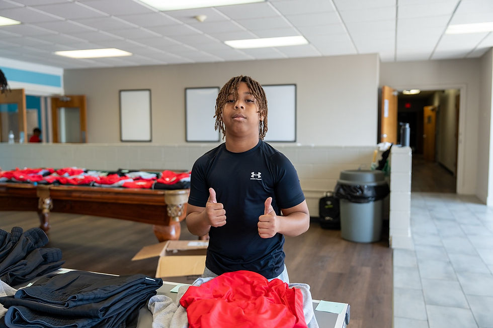 KJ at Kut Different Inc's Summer Leadership Academy setting up for the day.