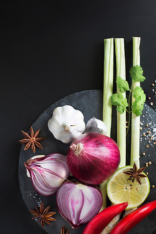 Asian spices red onion, garlic, lime, chilis, star anise, and celery