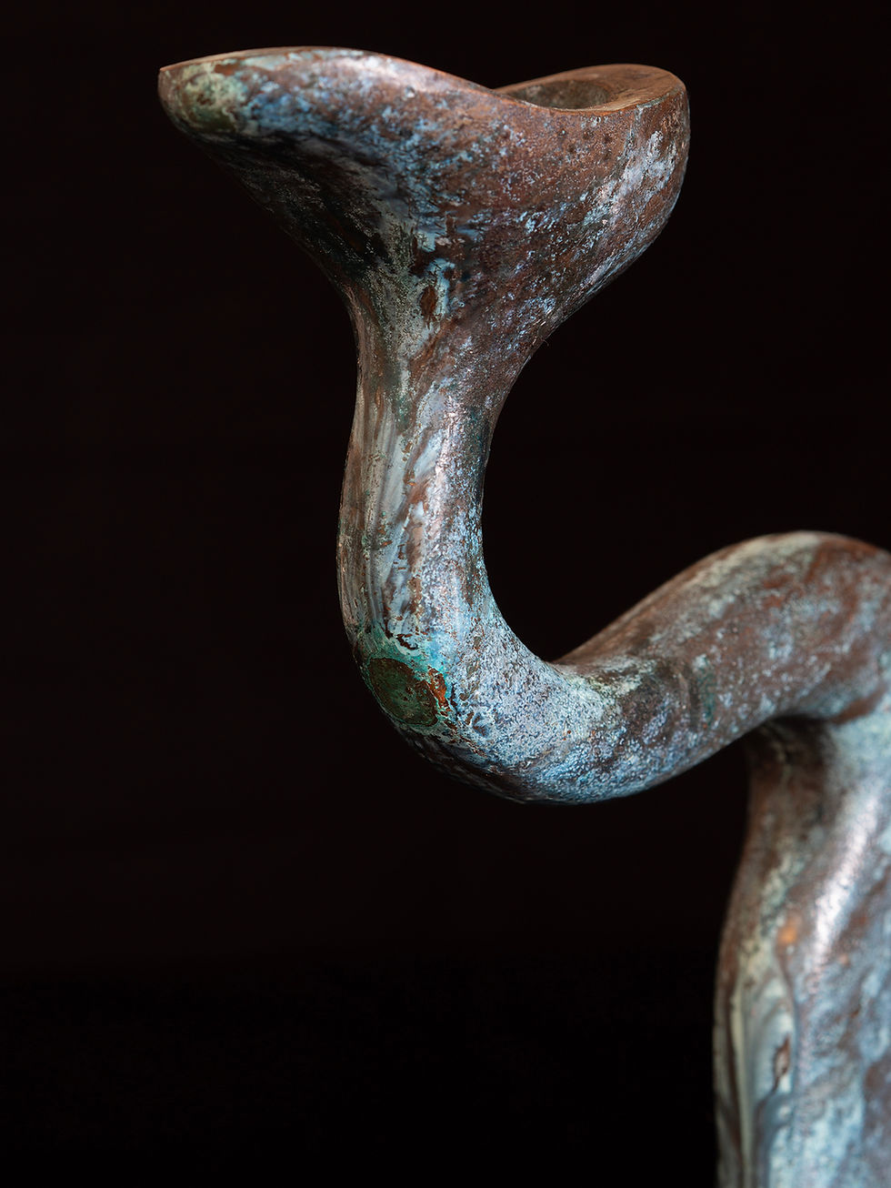 Thumbnail: A 2 arm candelabra with an organic, sinuous form cast in verdigris bronze