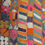 Thumbnail: a vintage Iraqi wedding blanket. extensively embroidered in vibrant pinks, reds, oranges, greens, purples etc