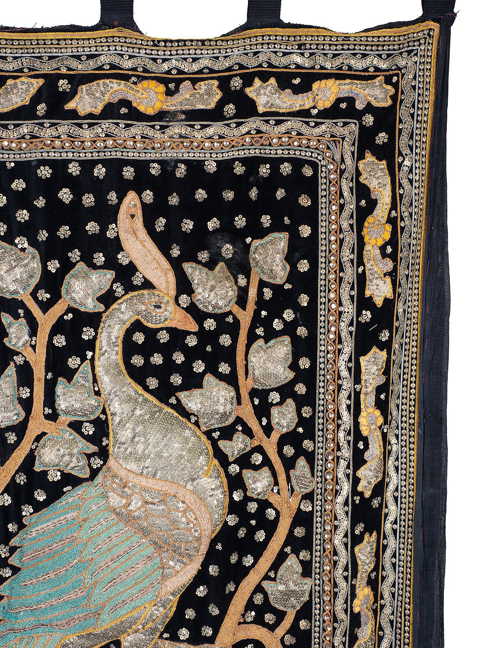 Thumbnail: A wall hanging with heavily embroidered peacock in turquoise threads on a black velvet ground
