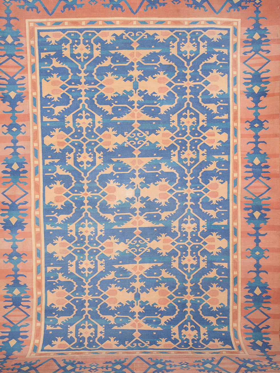 Thumbnail: An Indian flatweave dhurrie rug in soft tones of blues and coral pinks. In unusual lotto design