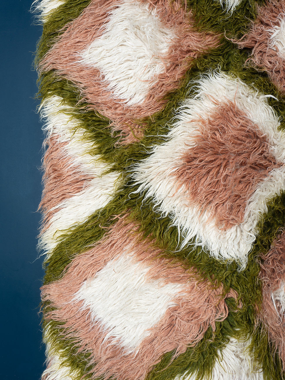 Thumbnail: A deep pile rug in a striking design of concentric diamonds in pink, green and white wool