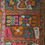 Thumbnail: a vintage Iraqi wedding blanket. extensively embroidered in vibrant pinks, reds, oranges, greens, purples etc