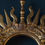 Thumbnail: a large carved giltwood sunburst with putti and swans to both sides