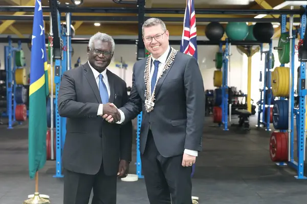 Prime Minister Manasseh Sogavare and Australia's Pacific Minister Pat Conroy at the Sports Institute shortly after making the announcement.