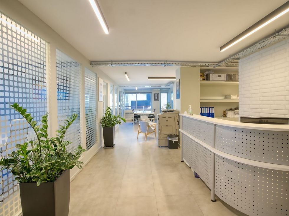 Wide angle view of a busy real estate office in Athens