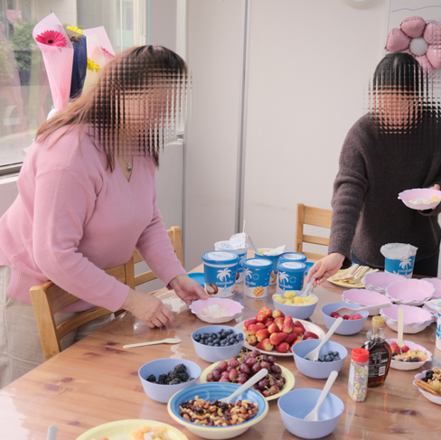 The Qs School Staff Room transformed into a cosy dessert space featuring refreshing yogurt bowls with DIY toppings.