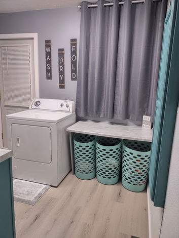 attractively decorated & organized laundry room