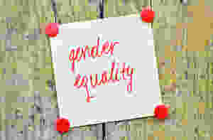 “Gender equality” written in red ink on a piece of paper tacked to wood