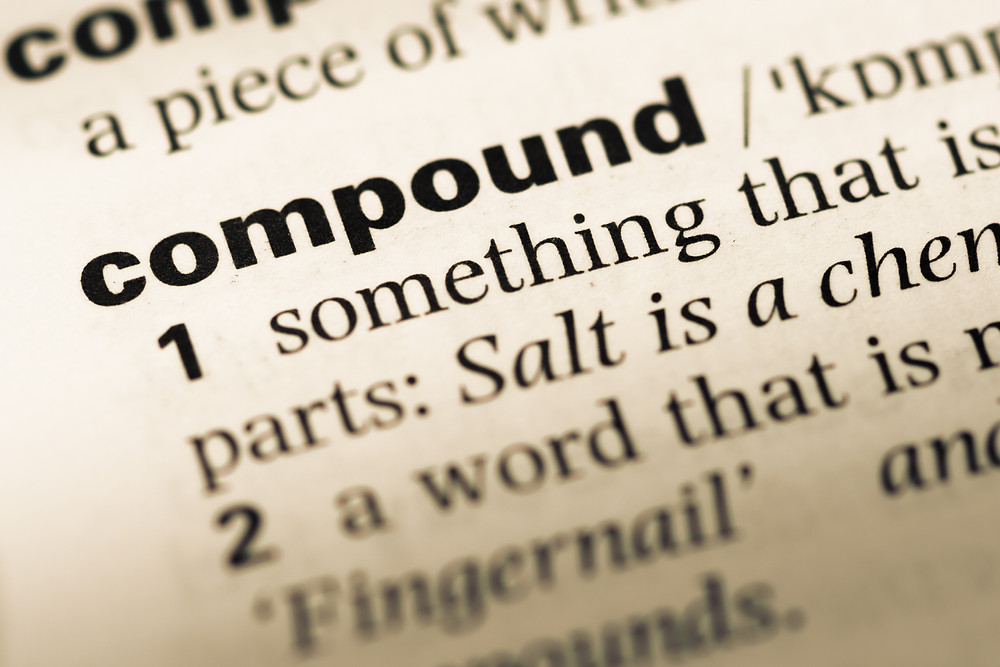 Close-up of the word "compound" in a dictionary entry.