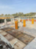 Construction site with concrete pillars and rebar mesh