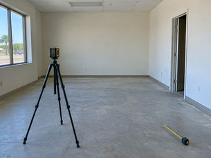 Laser measure and tape in an empty room used to calculate occupant load
