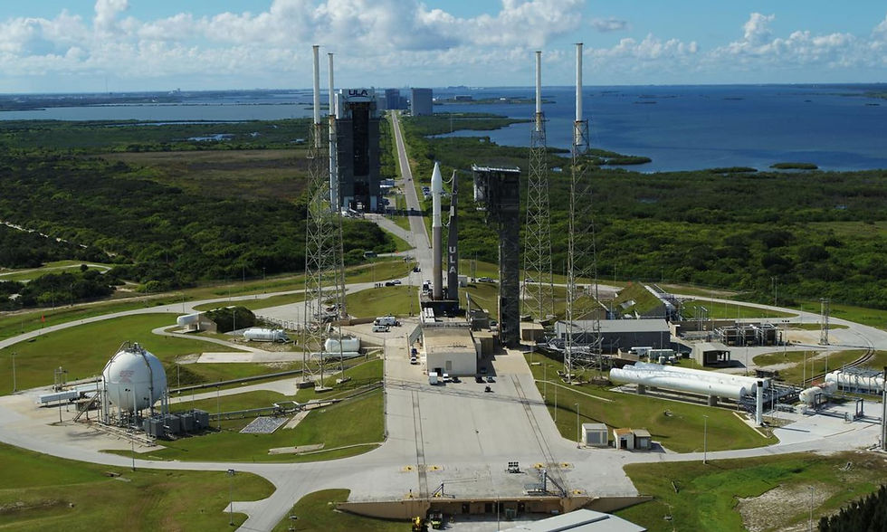 Aerial view of Cape Canaveral Space Force Station launch complex with rocket pad infrastructure and Florida coastline.