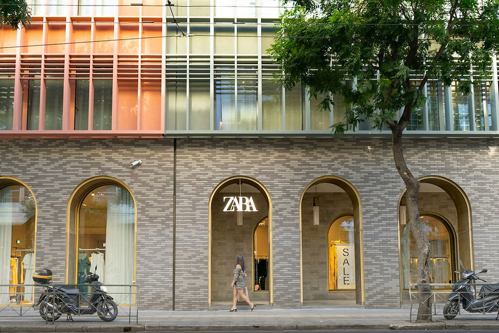 commercial retail storefront with large windows and parking lot