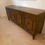 Thumbnail: Long Wooden Sideboard with Ornate Doors