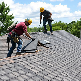 Show me a few roofers on the roof removing shingles off to be replaced on a residential home.jpg