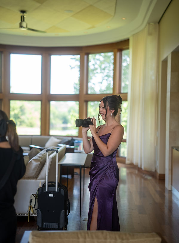 Bridesmaid using DIY wedding video camera kit to film ceremony