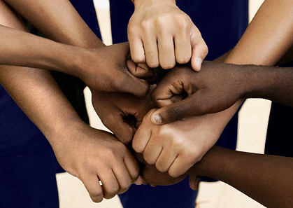 Team Putting Fists Together In Huddle_edited.jpg