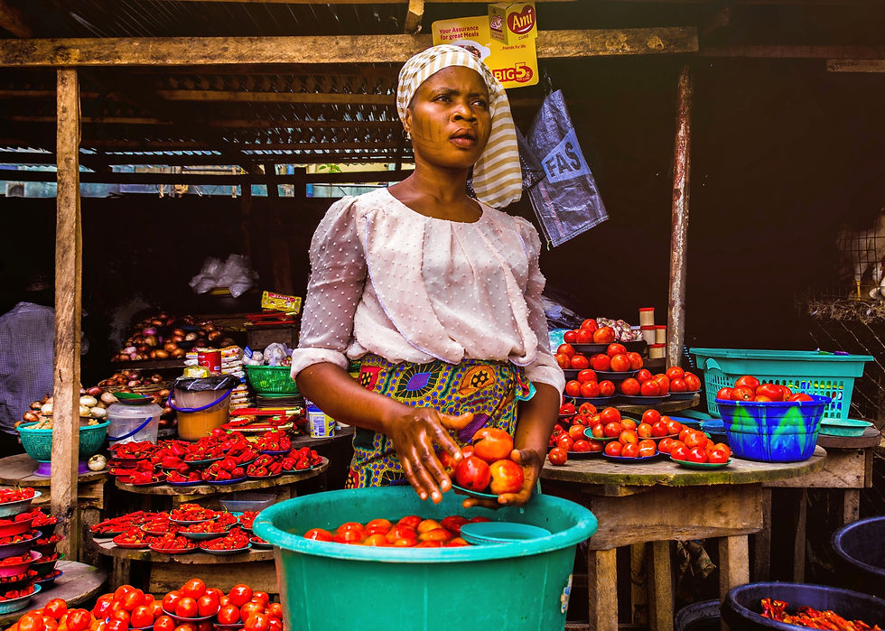 Woman selling tomatoes in the market