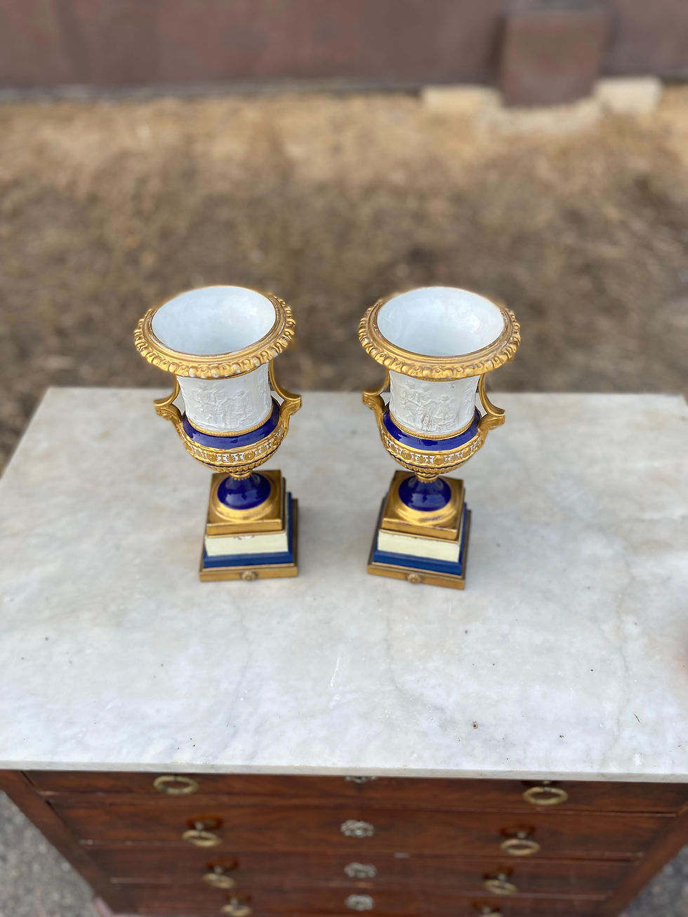 Thumbnail: Pair of 19th Century French Porcelain Urns with Neoclassical Scenes