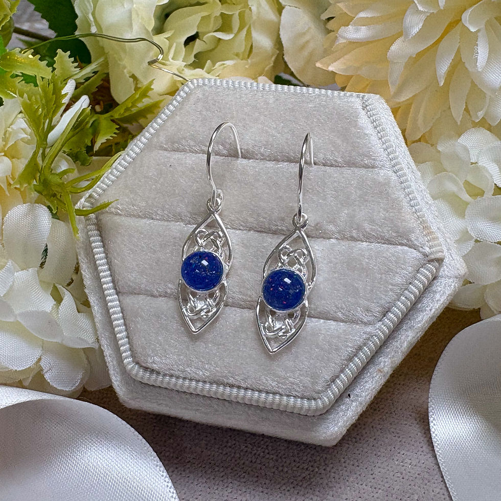 Silver Celtic drop memorial earrings set with indigo opals and ashes