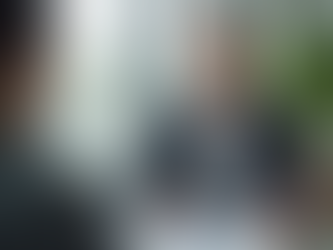 Eye-level view of a health insurance advisor explaining options to a client