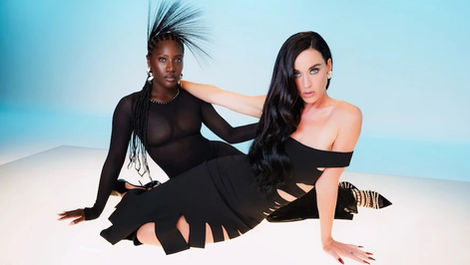 two woman sitting cross-legged