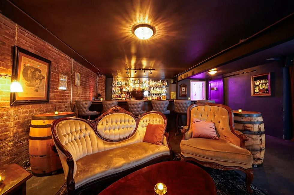 Velvet settees and exposed brick at Broadway Roxy Speakeasy on South Broadway, Denver