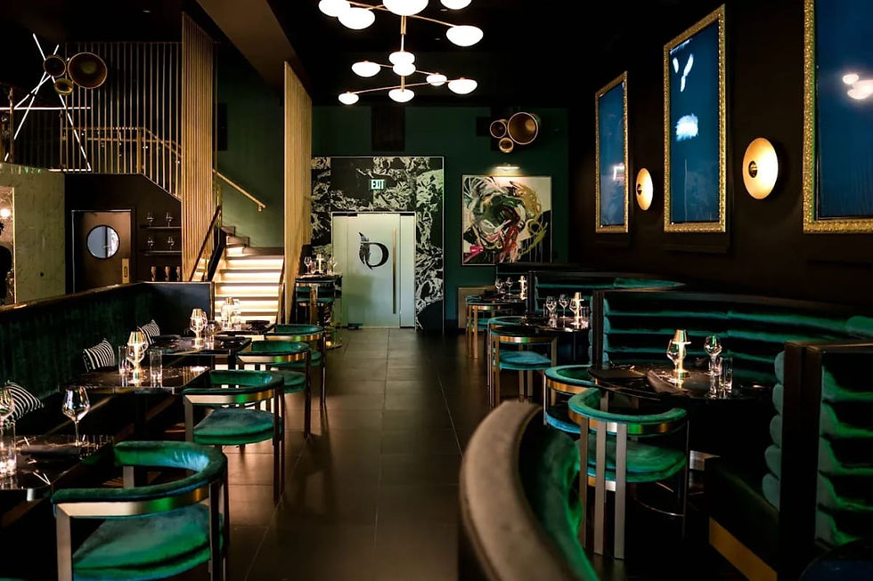 Dining room with green banquettes at Doves Restaurant in Midtown Houston