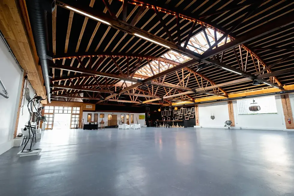Gallery space set with round tables for an event at Xoco House Gallery in Pilsen, Chicago