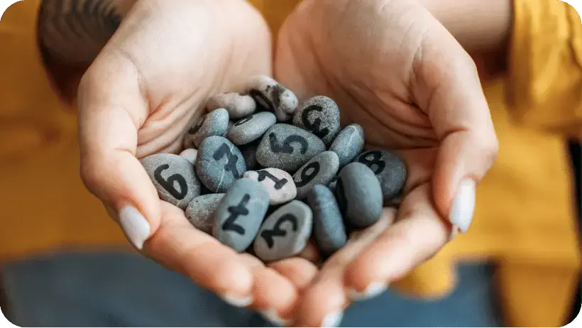pebbles with numbers written on them