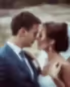 Bride and groom embrace.avif