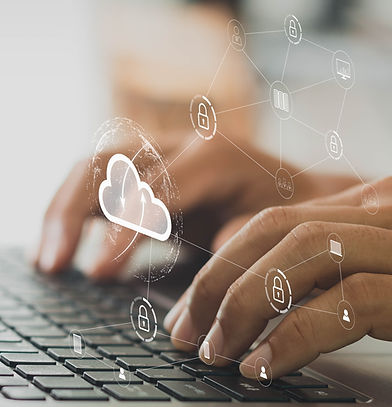 businessman working on his laptop in the home office selects icon cloud on the virtual dis