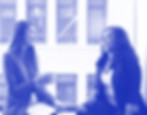 Two employees talking in the office
