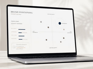 A refined laptop workspace with a minimal abstract brand strategy diagram, representing brand positioning for private clubs and discerning service brands.