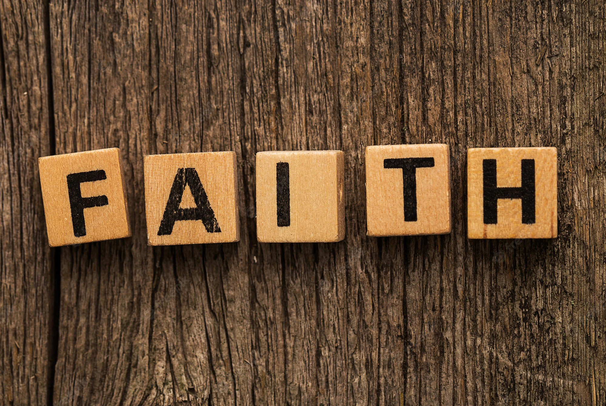 toy-bricks-table-with-word-faith_144627-47474.webp