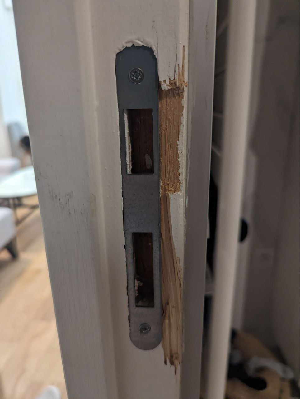 Damaged door strike plate in Toronto home needing repair