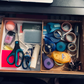 Inside of a well organized desk drawer