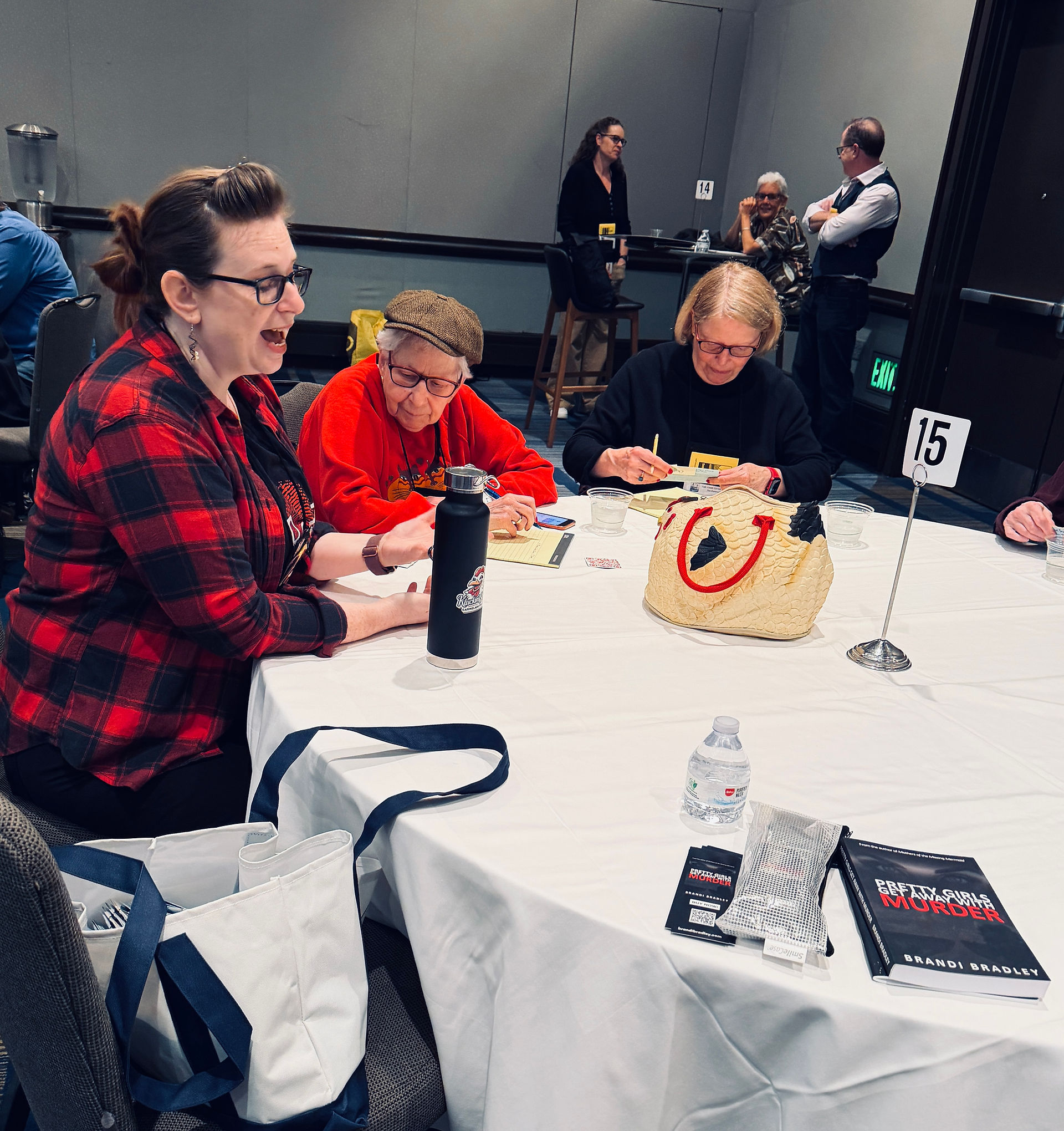 Author sitting with people