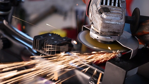 metal-worker-grinding-steelusing-grinder