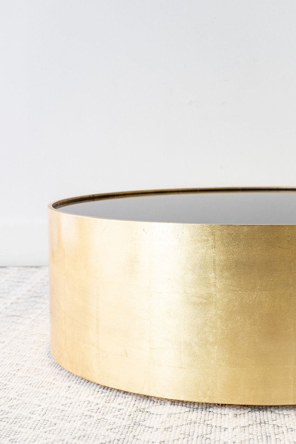 Gold round coffee table with black glass top gold finish
