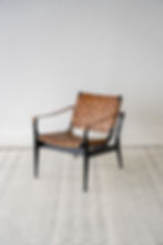 Brown leather accent chair black legs front angle view