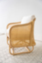 Oak rattan frame cream plush cushion accent chair side view