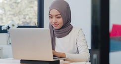 beautiful-asian-muslim-lady-casual-wear-working-using-laptop-modern-new-normal-office.jpg