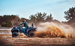 teen-riding-atv-sand-dunes-making-turn-sand (1).jpg