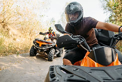 two-quad-bike-riders-travels-forest-front-view.jpg